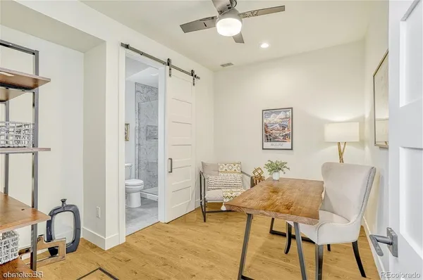 a view of a livingroom with furniture and a window