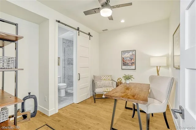 a view of a livingroom with furniture and a window