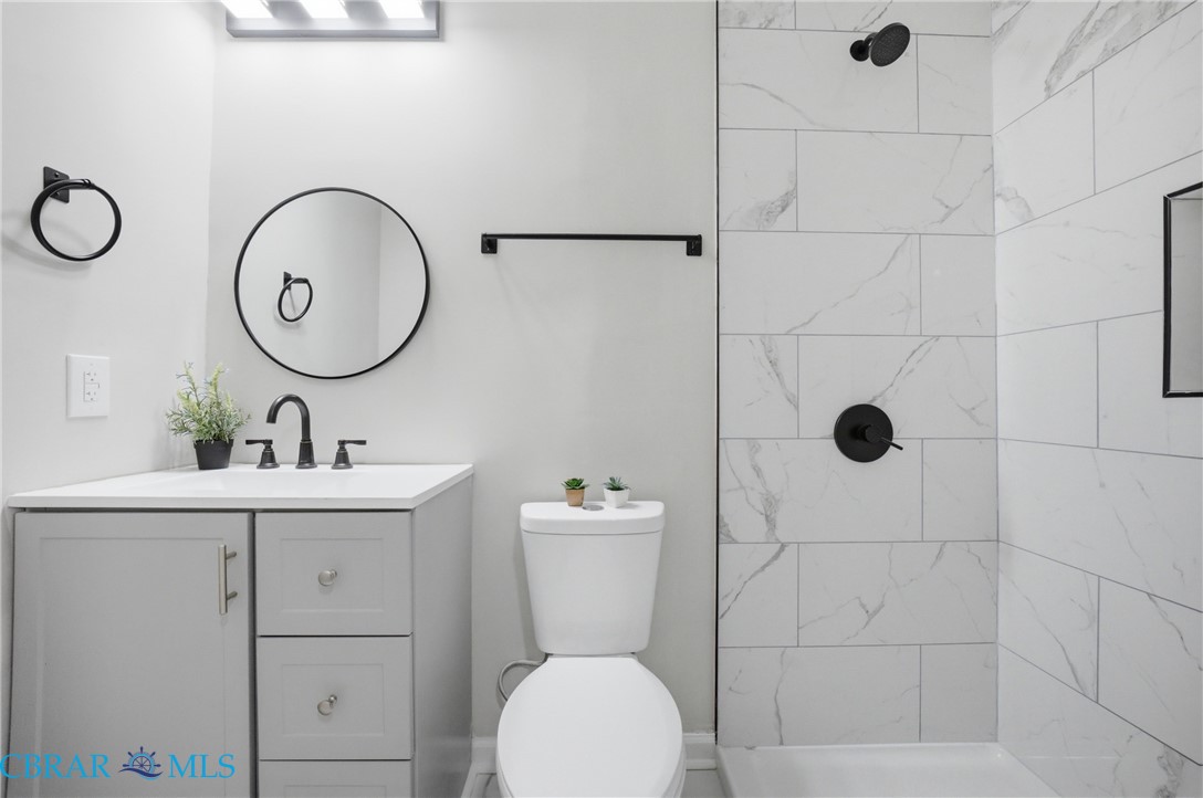 733 Spruce Street Hampton, VA 23661 - Photo 21 of 29 Bathroom with vanity and a shower stall