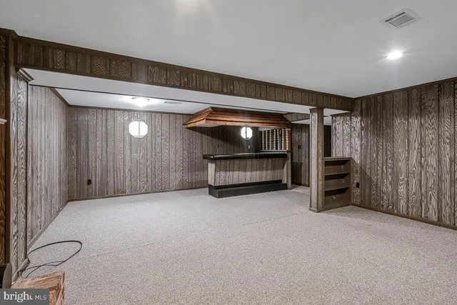 a view of an empty room with a fireplace