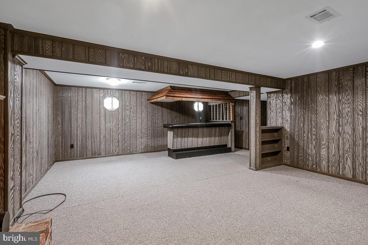 6912 Eilerson Street Clinton, MD 20735 - Photo 23 of 28 a view of an empty room with a fireplace