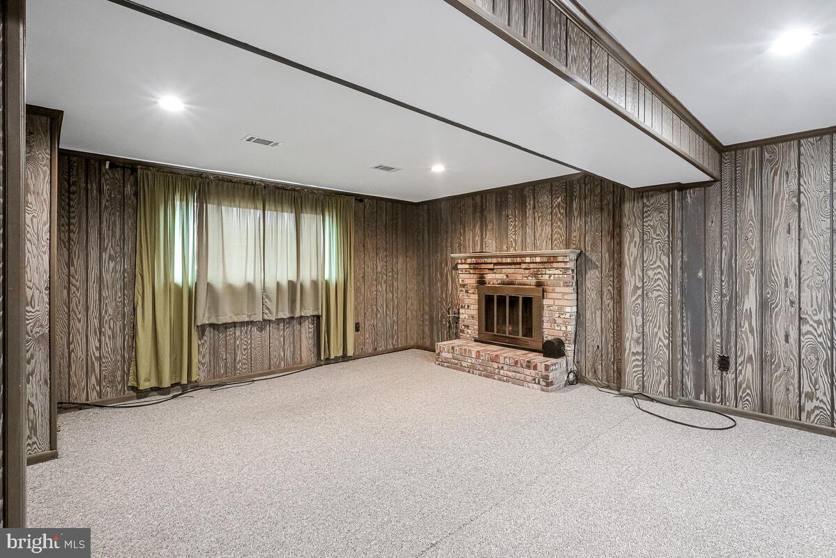 6912 Eilerson Street Clinton, MD 20735 - Photo 24 of 28 a view of an empty room with a fireplace