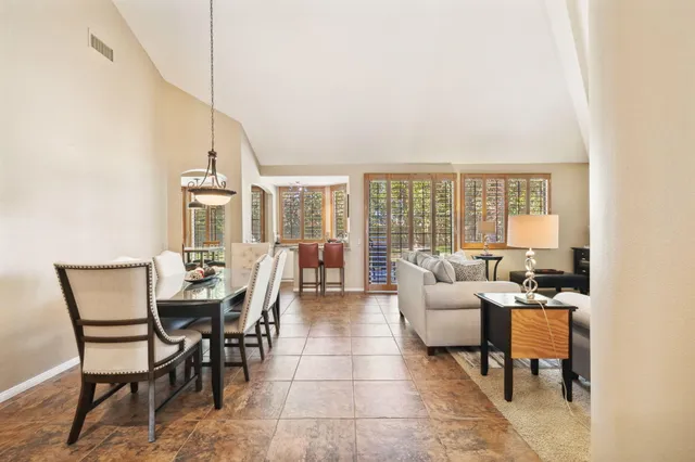 a kitchen with granite countertop cabinets and refrigerator