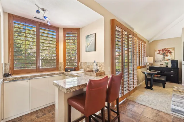 a bathroom with a tub sink and a large mirror