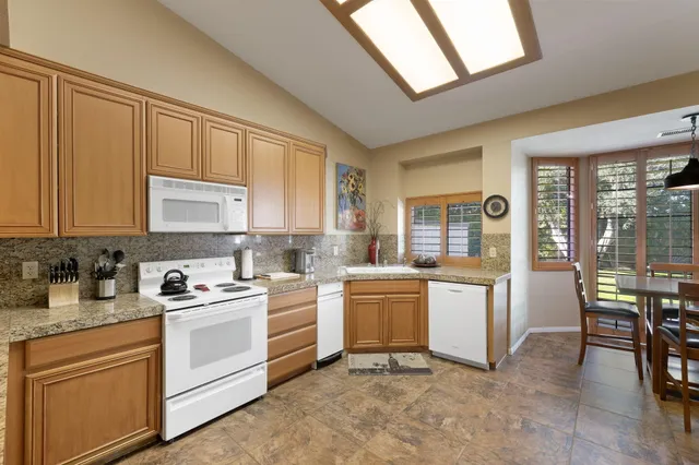 a spacious bathroom with a bathtub and a shower