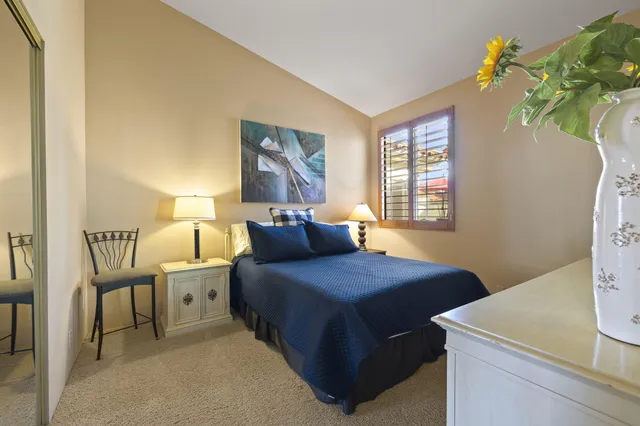 a view of a swimming pool with a patio and a garden