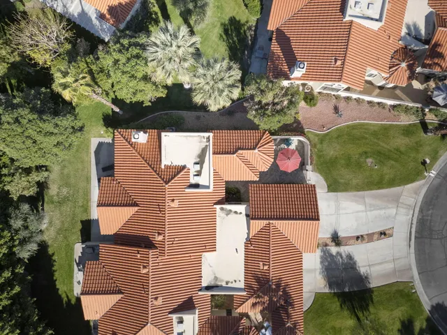 a view of a swimming pool with a table and chairs