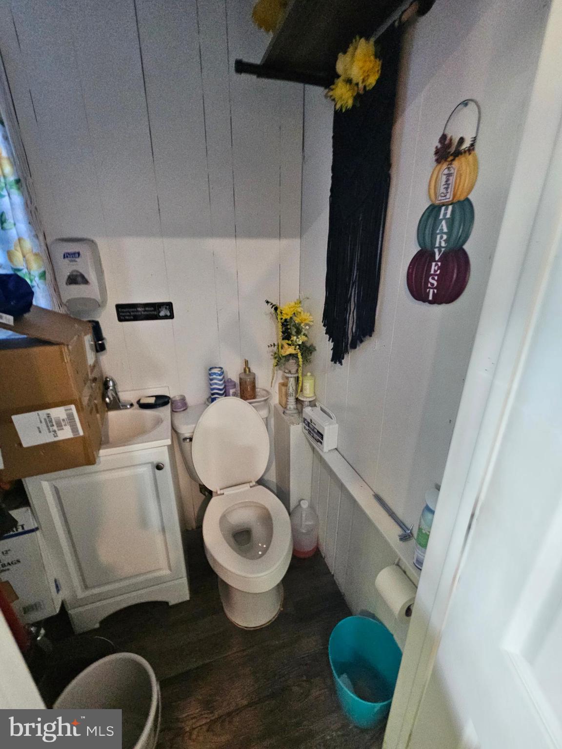 221 Broadway Westville, NJ 08093 - Photo 13 of 51 a bathroom with a toilet and a shower curtain