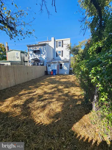 a view of a house with backyard space and balcony