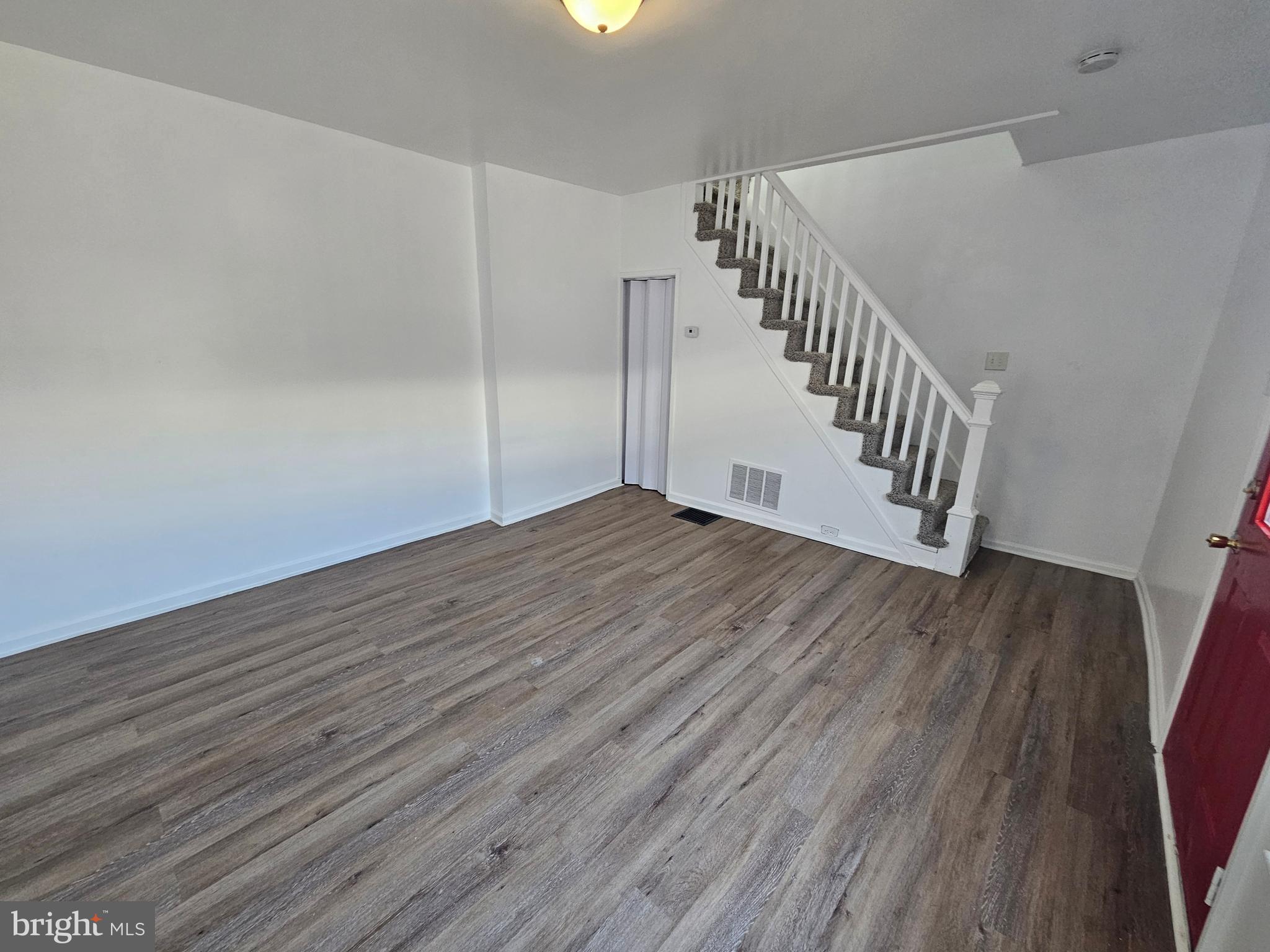 221 Broadway Westville, NJ 08093 - Photo 26 of 51 a view of an empty room with wooden floor
