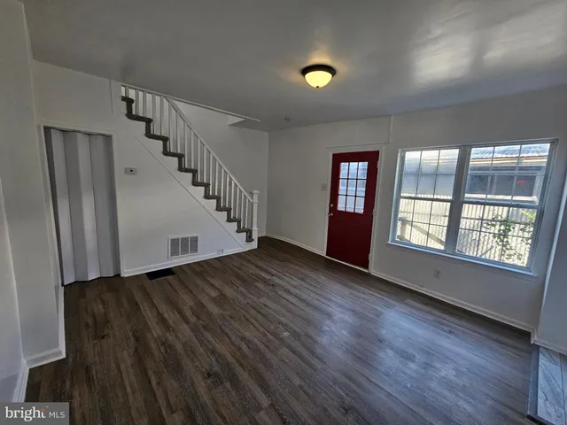 a kitchen with cabinets and appliances