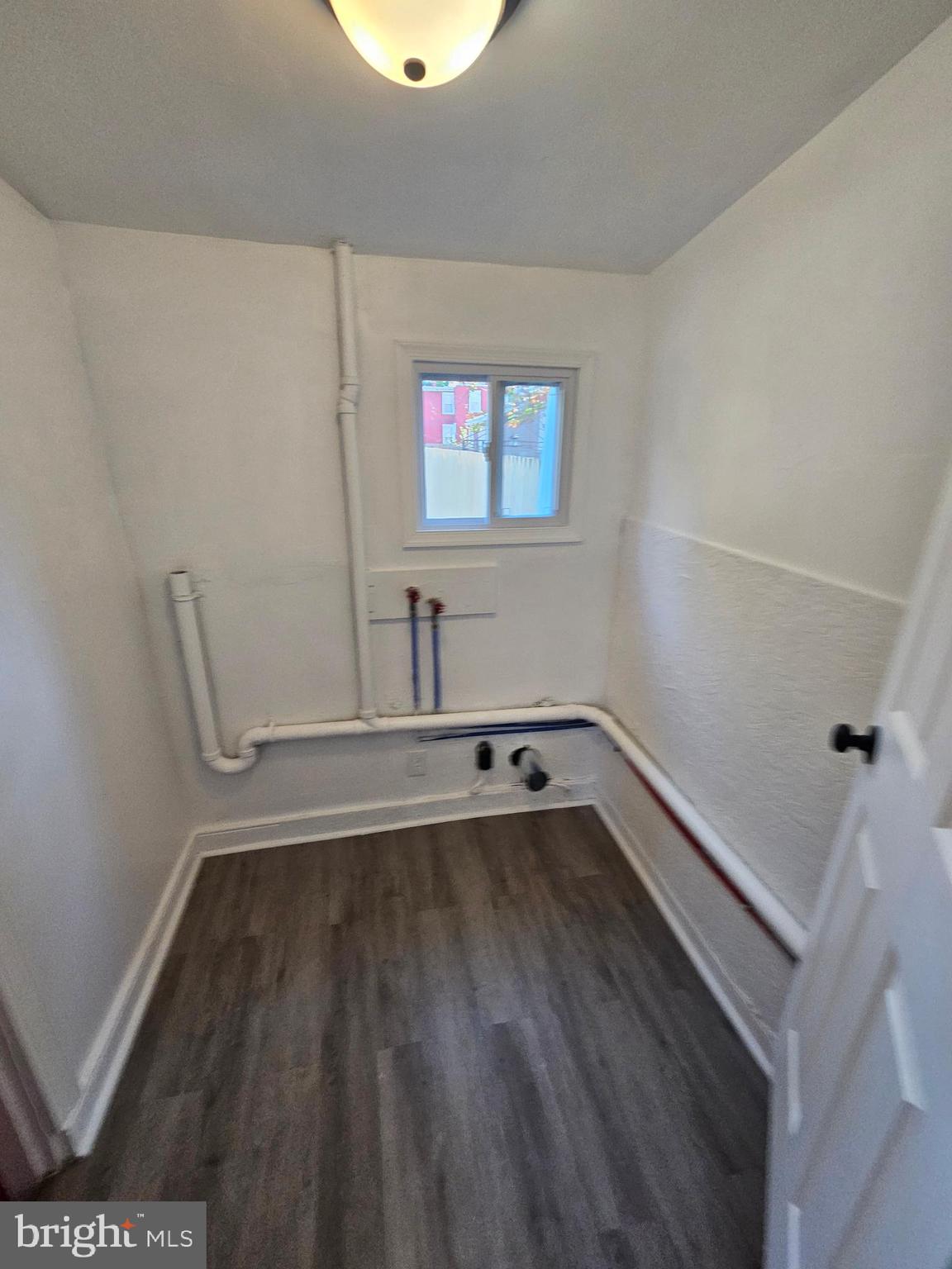 221 Broadway Westville, NJ 08093 - Photo 34 of 51 a view of a room with wooden floor and small window