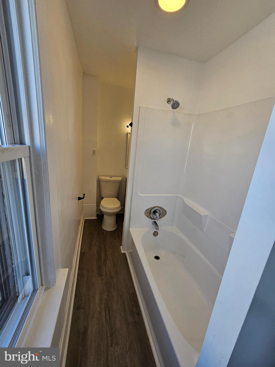 221 Broadway Westville, NJ 08093 - Photo 41 of 51 a bathroom with a bathtub and a toilet