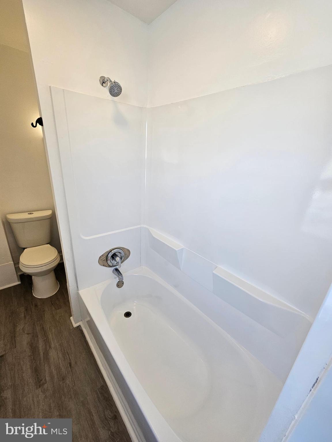 221 Broadway Westville, NJ 08093 - Photo 42 of 51 a bathroom with a bathtub and a toilet