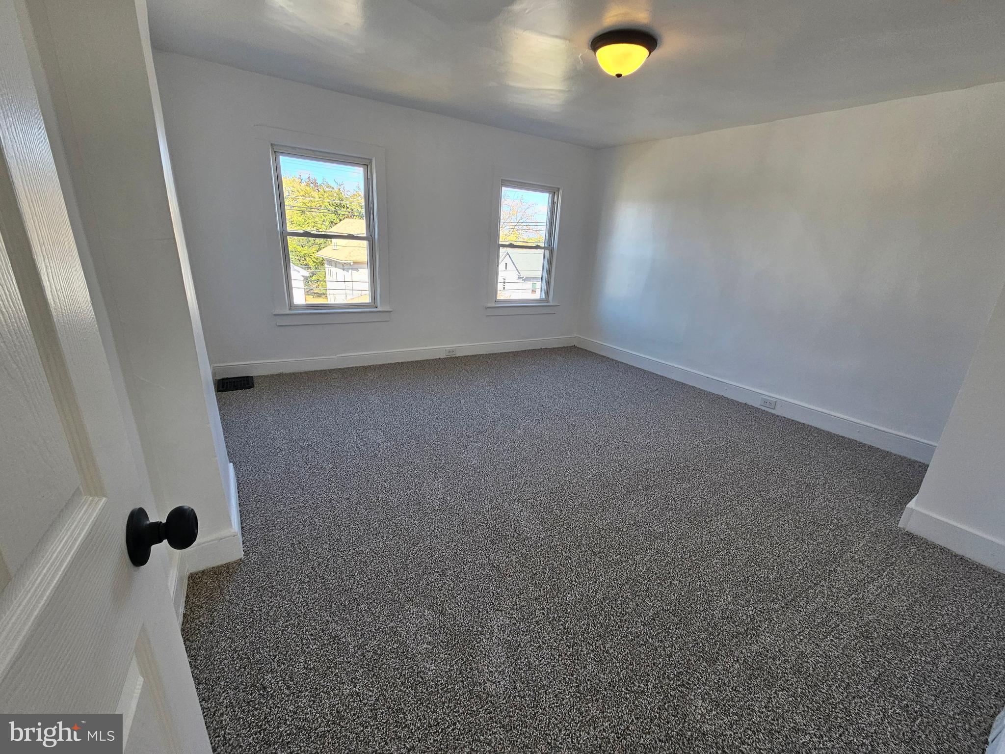 221 Broadway Westville, NJ 08093 - Photo 46 of 51 wooden floor in an empty room with a window