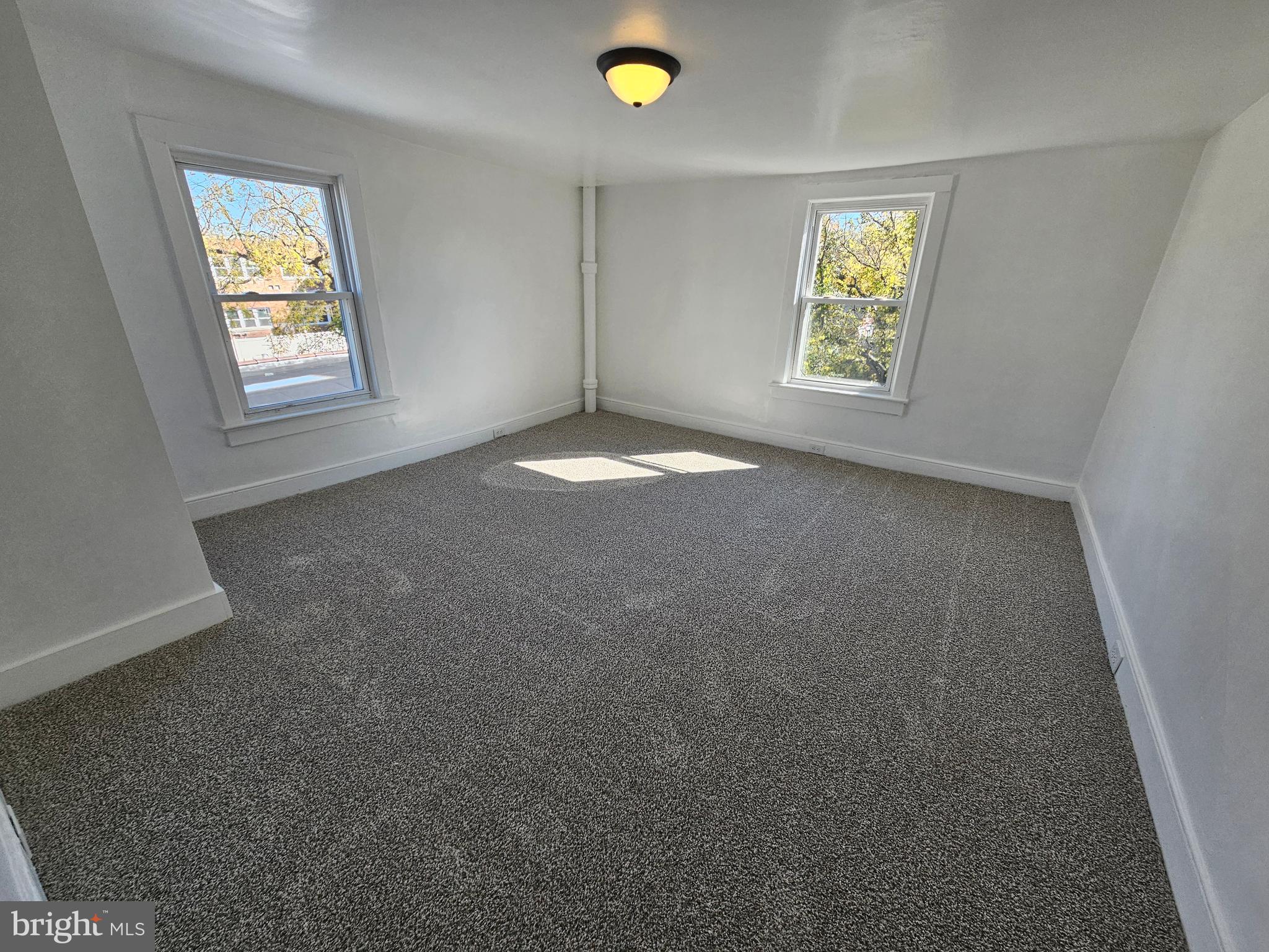 221 Broadway Westville, NJ 08093 - Photo 49 of 51 an empty room with windows and closet