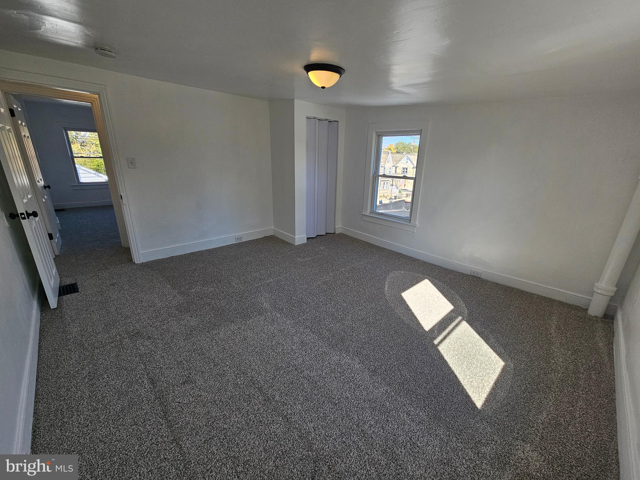 221 Broadway Westville, NJ 08093 - Photo 50 of 51 an empty room with windows and closet