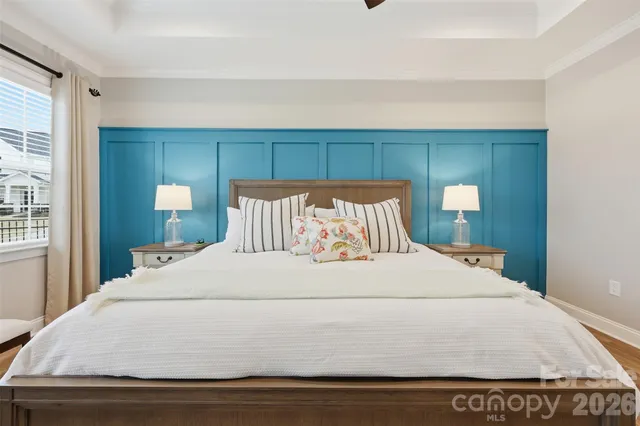 a bedroom with a bed and window