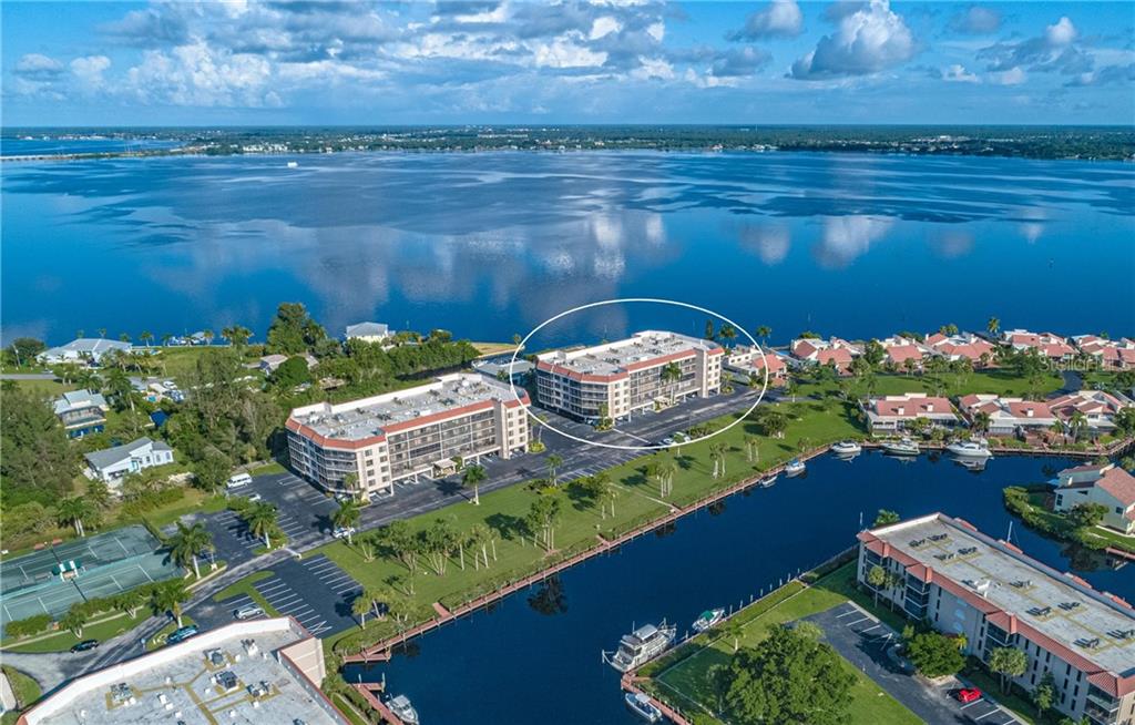 MAGNIFICENT WATERFRONT VIEWS OF CHARLOTTE HARBOR! TURNKEY 2 BEDROOM, 2 BATH CONDO IN HIGHLY DESIRED GATED COMMUNITY OF EMERALD POINTE!