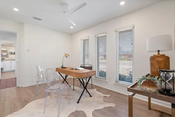 a workspace with furniture and a window