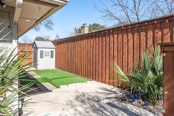 a backyard of a house with lots of green space