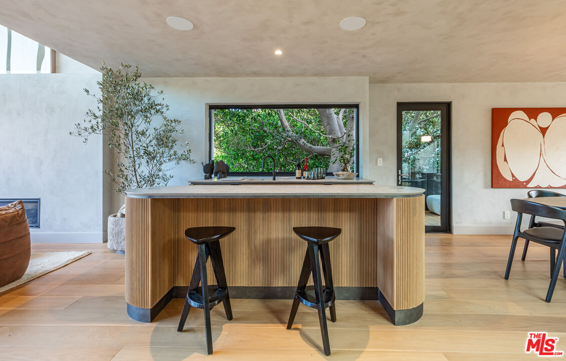 23505 Malibu Colony Road Malibu, CA 90265 - Photo 20 of 39 a view of a livingroom with furniture and a potted plant