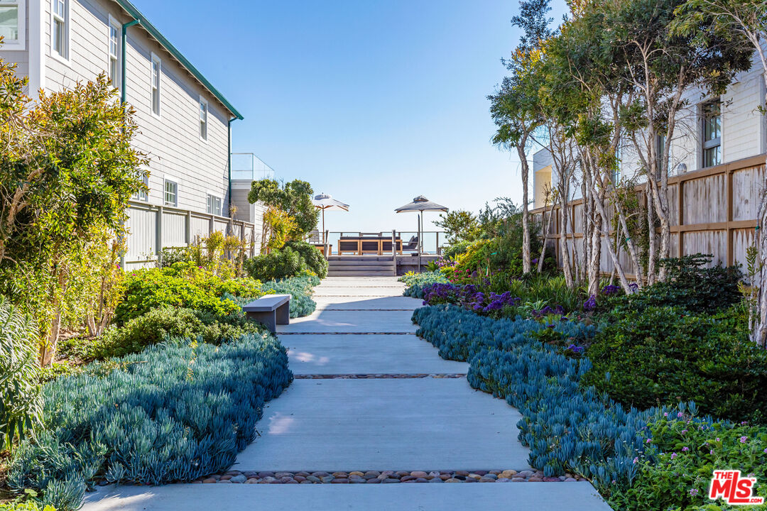 23505 Malibu Colony Road Malibu, CA 90265 - Photo 2 of 39 a view of a pathway with flower plants