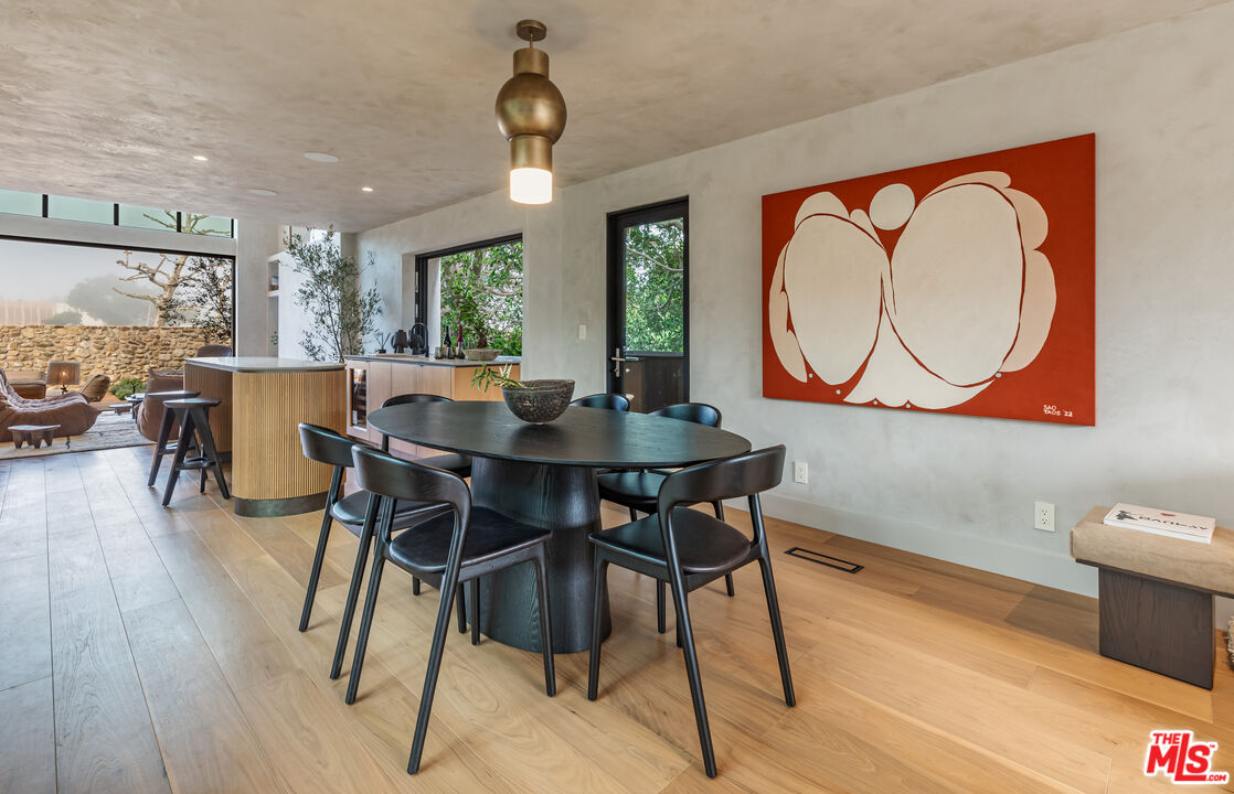 23505 Malibu Colony Road Malibu, CA 90265 - Photo 22 of 39 a view of a dining room with furniture window and wooden floor