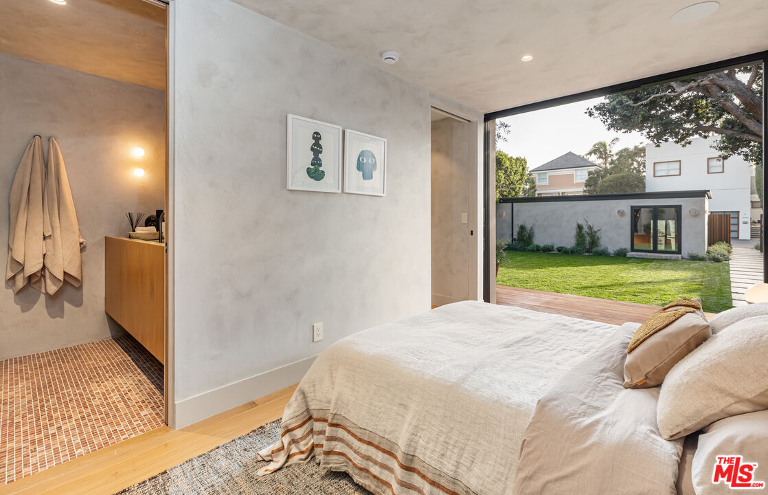 23505 Malibu Colony Road Malibu, CA 90265 - Photo 24 of 39 a view of a bedroom with a bed and balcony