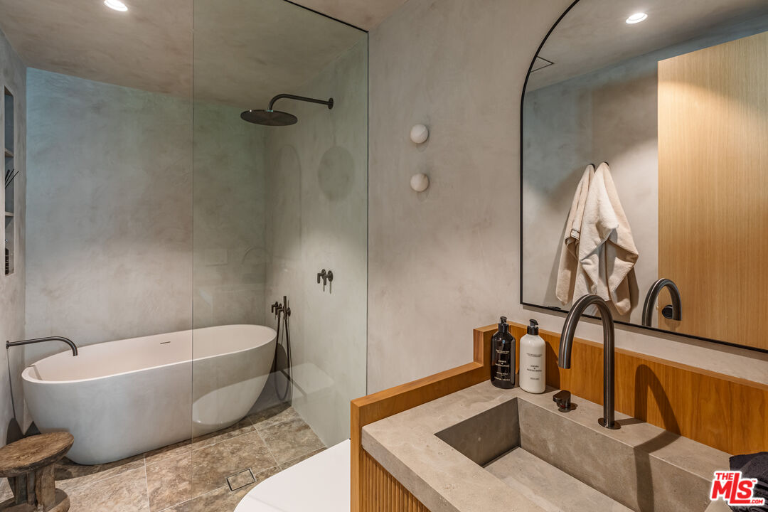 23505 Malibu Colony Road Malibu, CA 90265 - Photo 29 of 39 a white bath tub sitting next to a white toilet and sink
