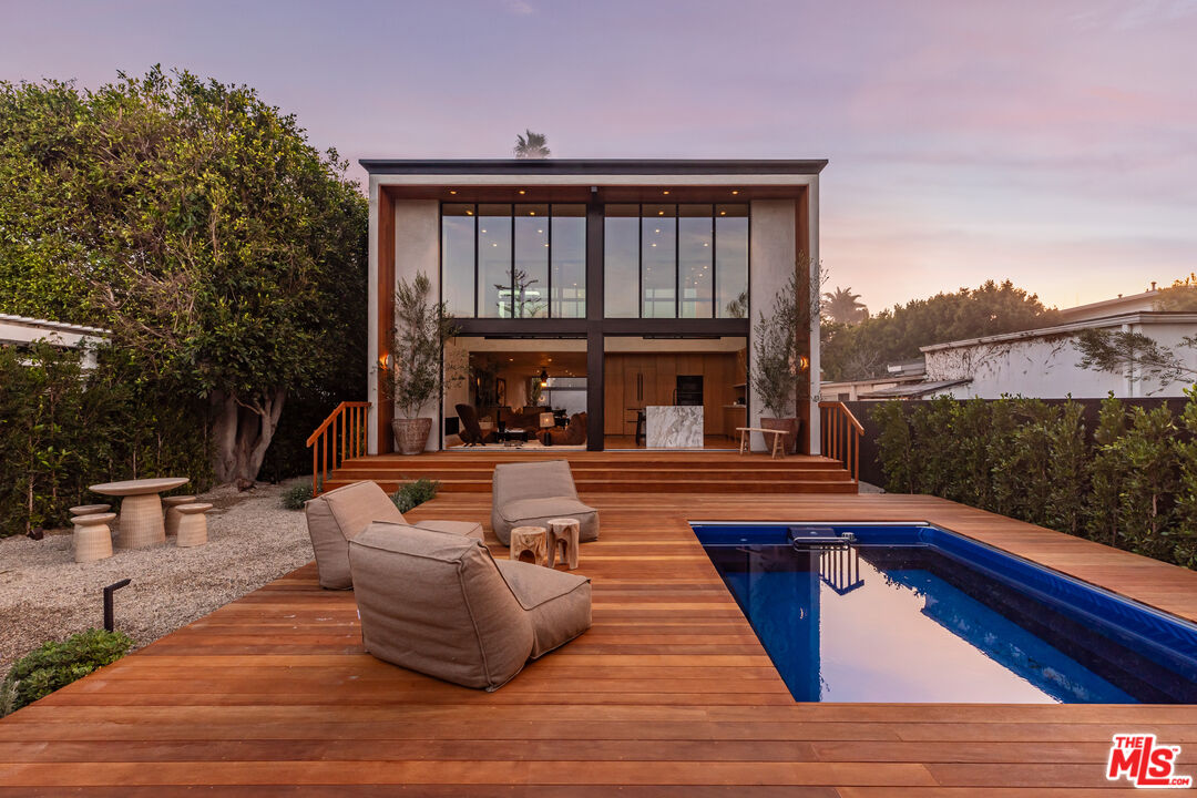 23505 Malibu Colony Road Malibu, CA 90265 - Photo 34 of 39 a view of a roof deck with couches and wooden floor