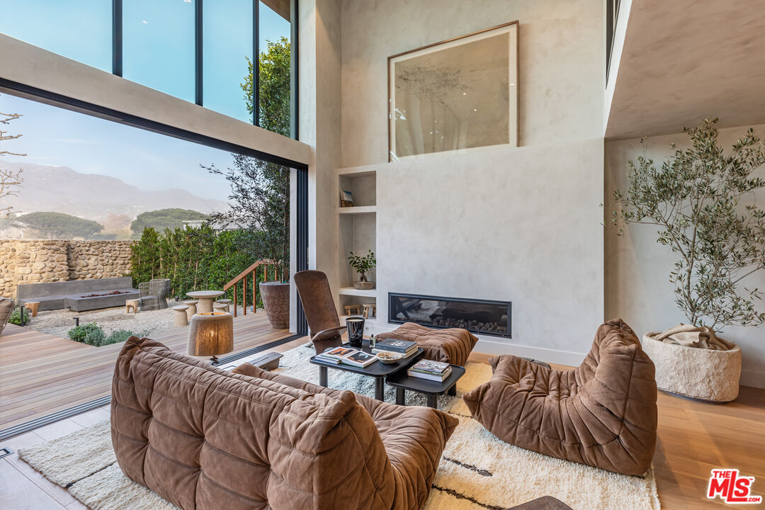 23505 Malibu Colony Road Malibu, CA 90265 - Photo 10 of 39 a living room with furniture and a large window