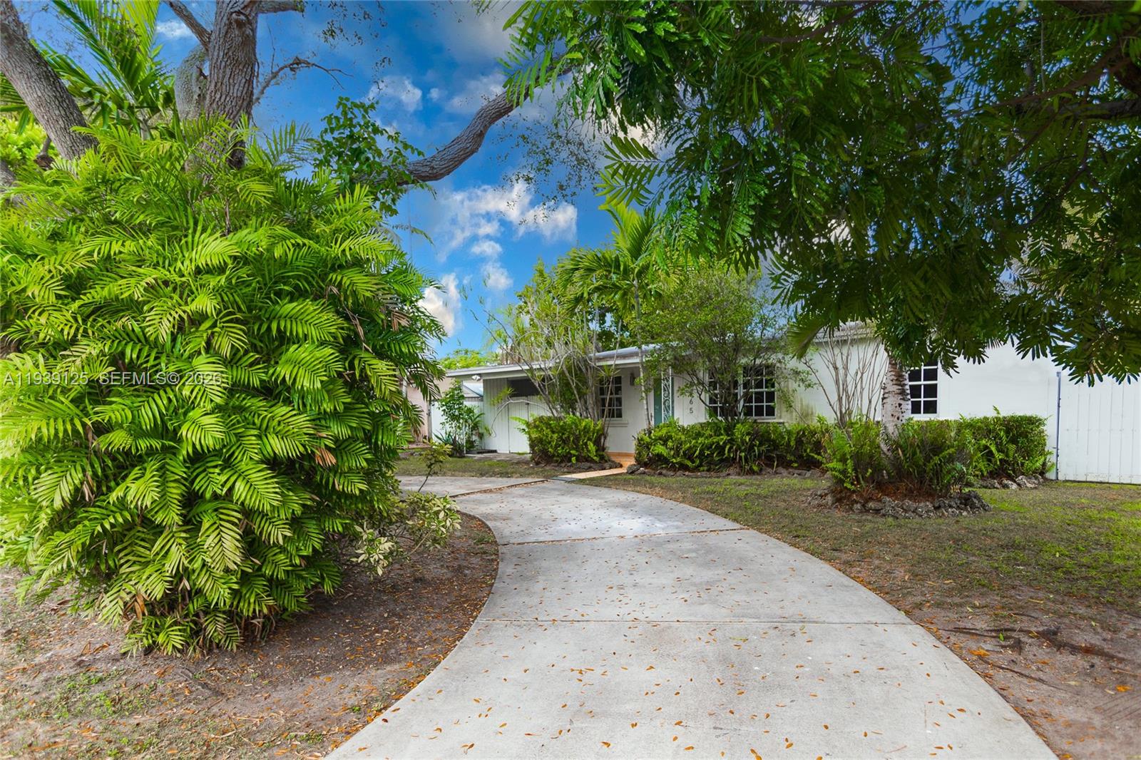 6765 Southwest 51st Street Miami, FL 33155 - Photo 13 of 43 front view of a house with a street