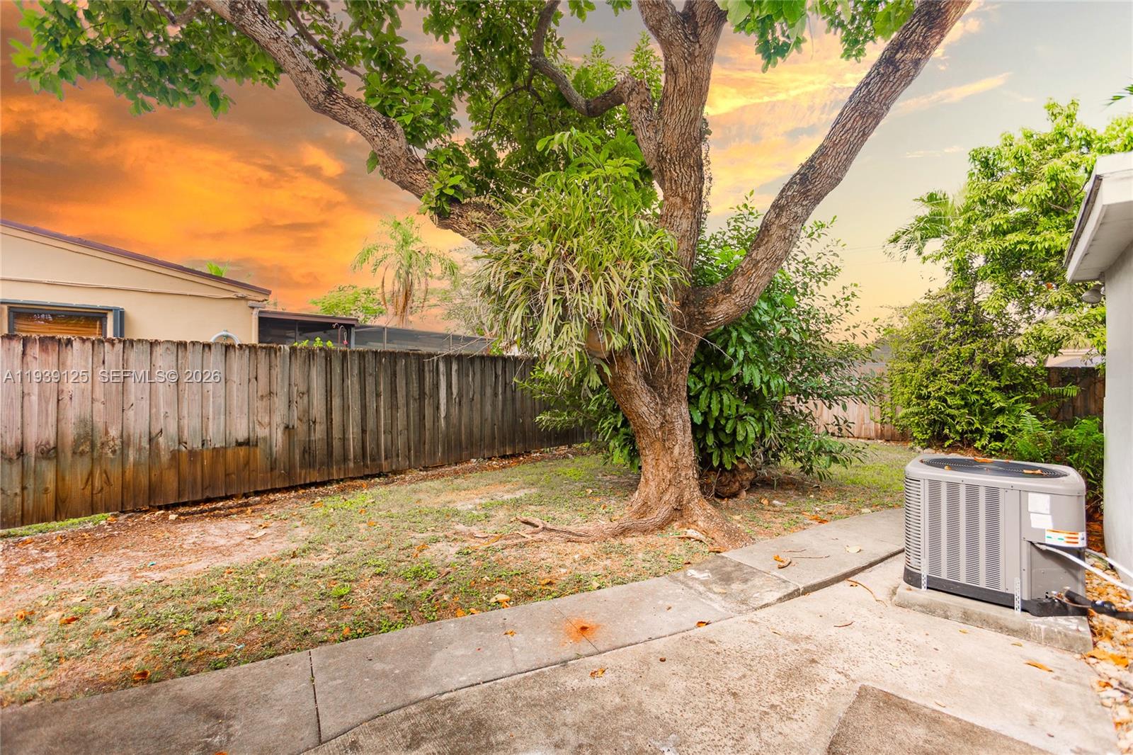 6765 Southwest 51st Street Miami, FL 33155 - Photo 17 of 43 a backyard of a house with lots of green space