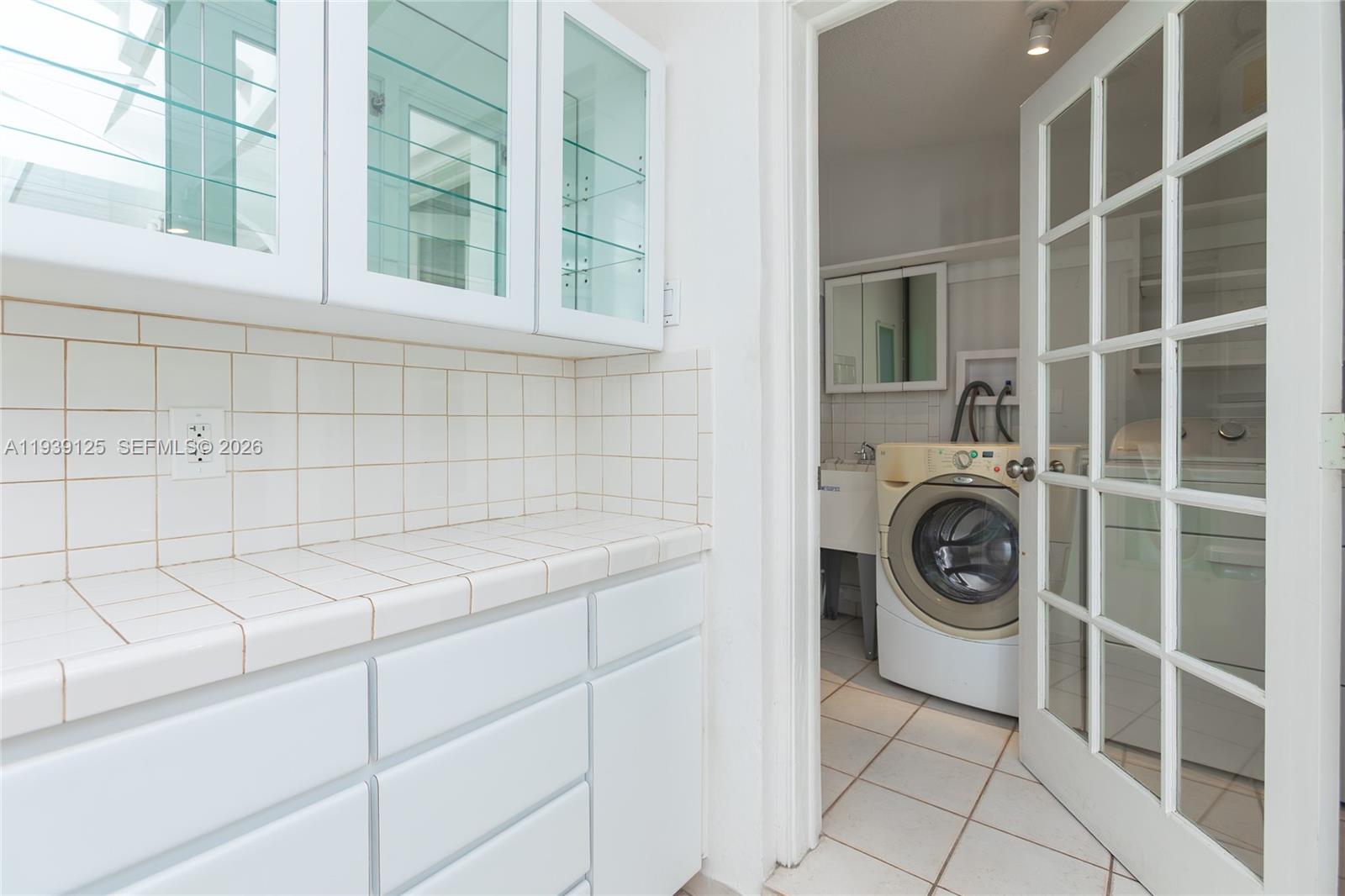 6765 Southwest 51st Street Miami, FL 33155 - Photo 32 of 43 a utility room with dryer and washer