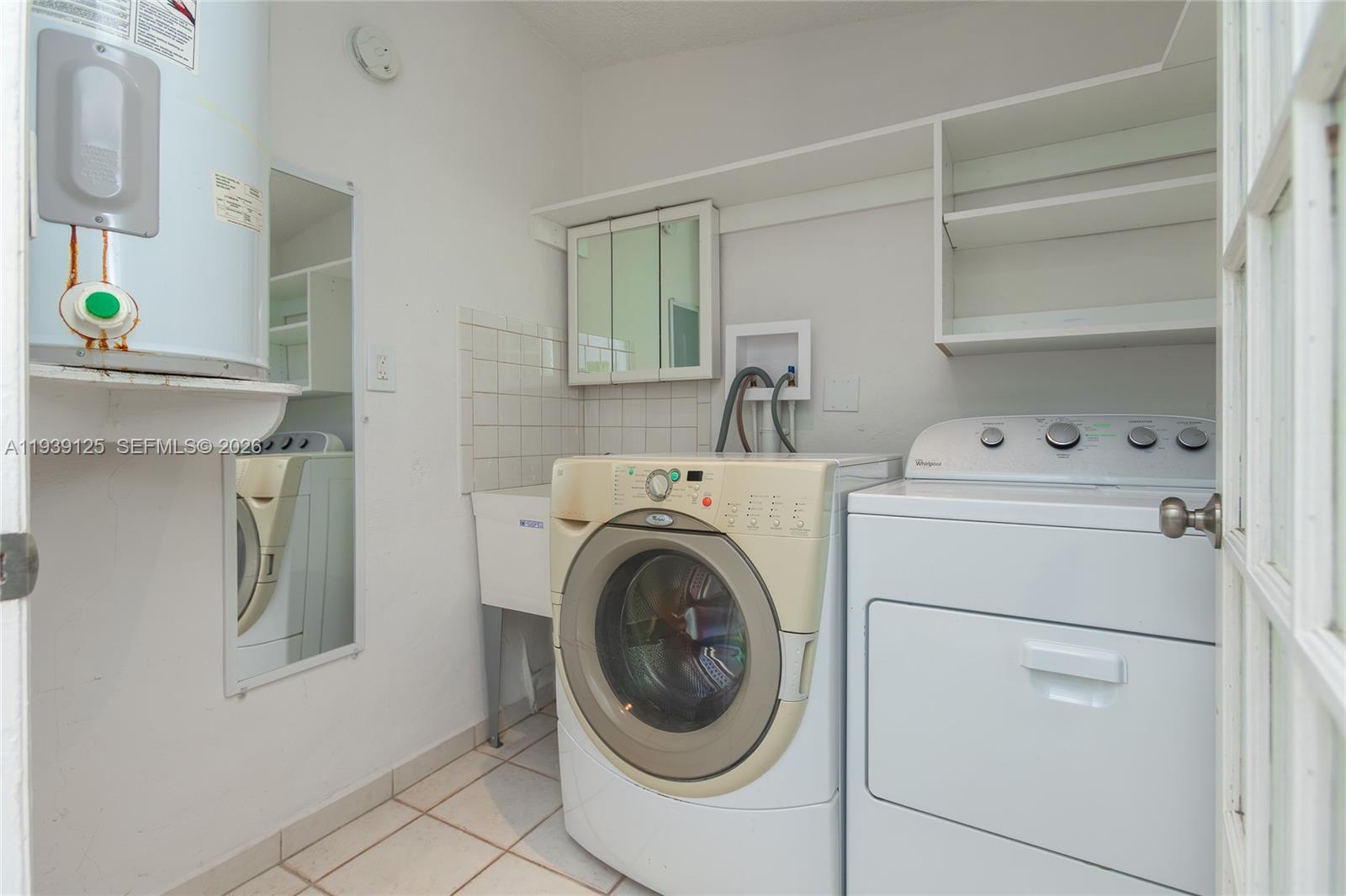 6765 Southwest 51st Street Miami, FL 33155 - Photo 33 of 43 a utility room with dryer and washer