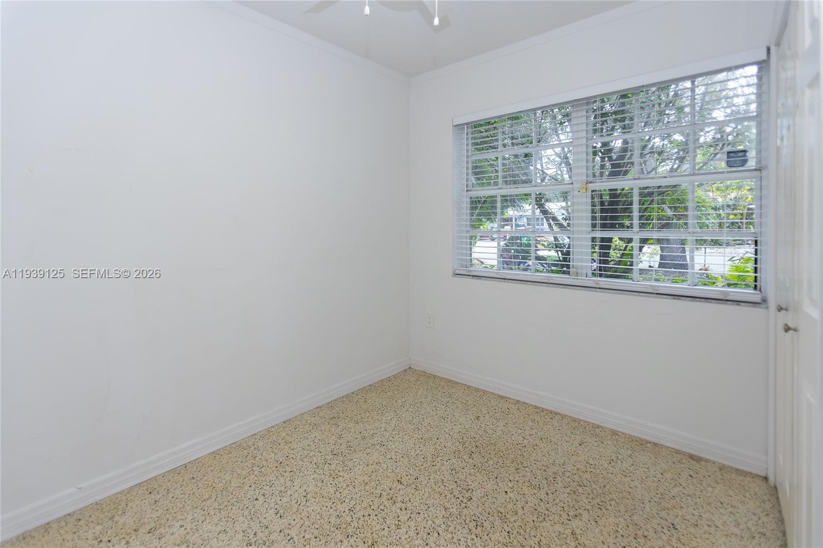 6765 Southwest 51st Street Miami, FL 33155 - Photo 36 of 43 a view of an empty room with a window