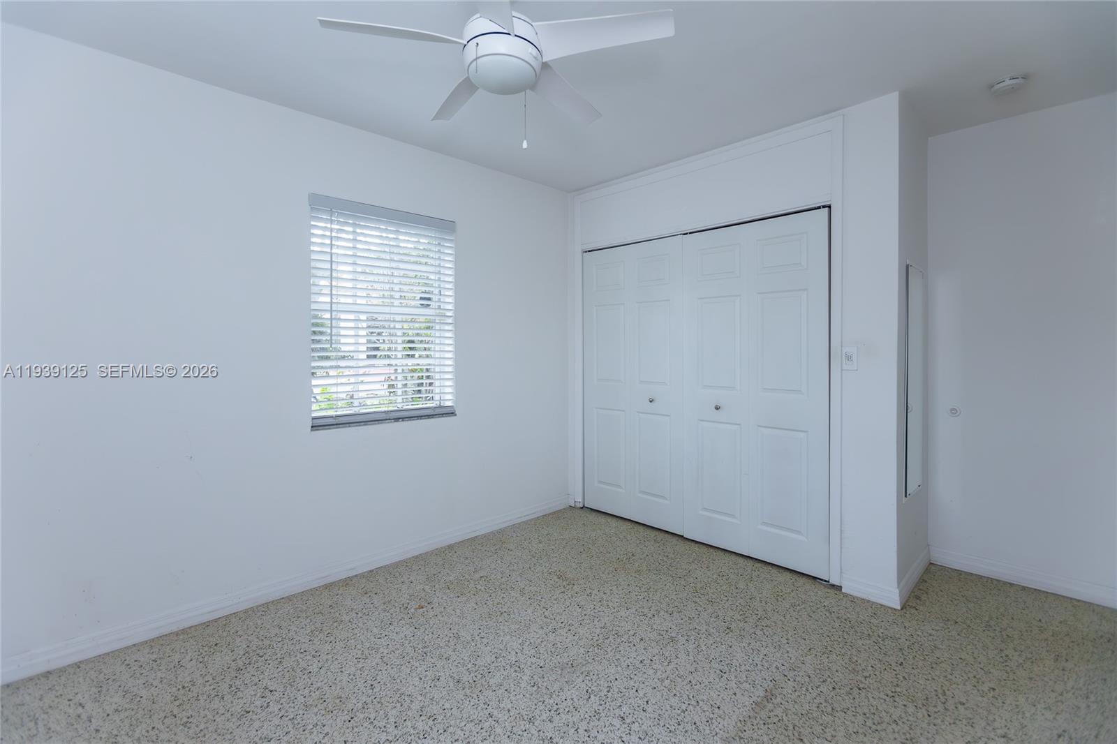 6765 Southwest 51st Street Miami, FL 33155 - Photo 39 of 43 a view of an empty room with a window