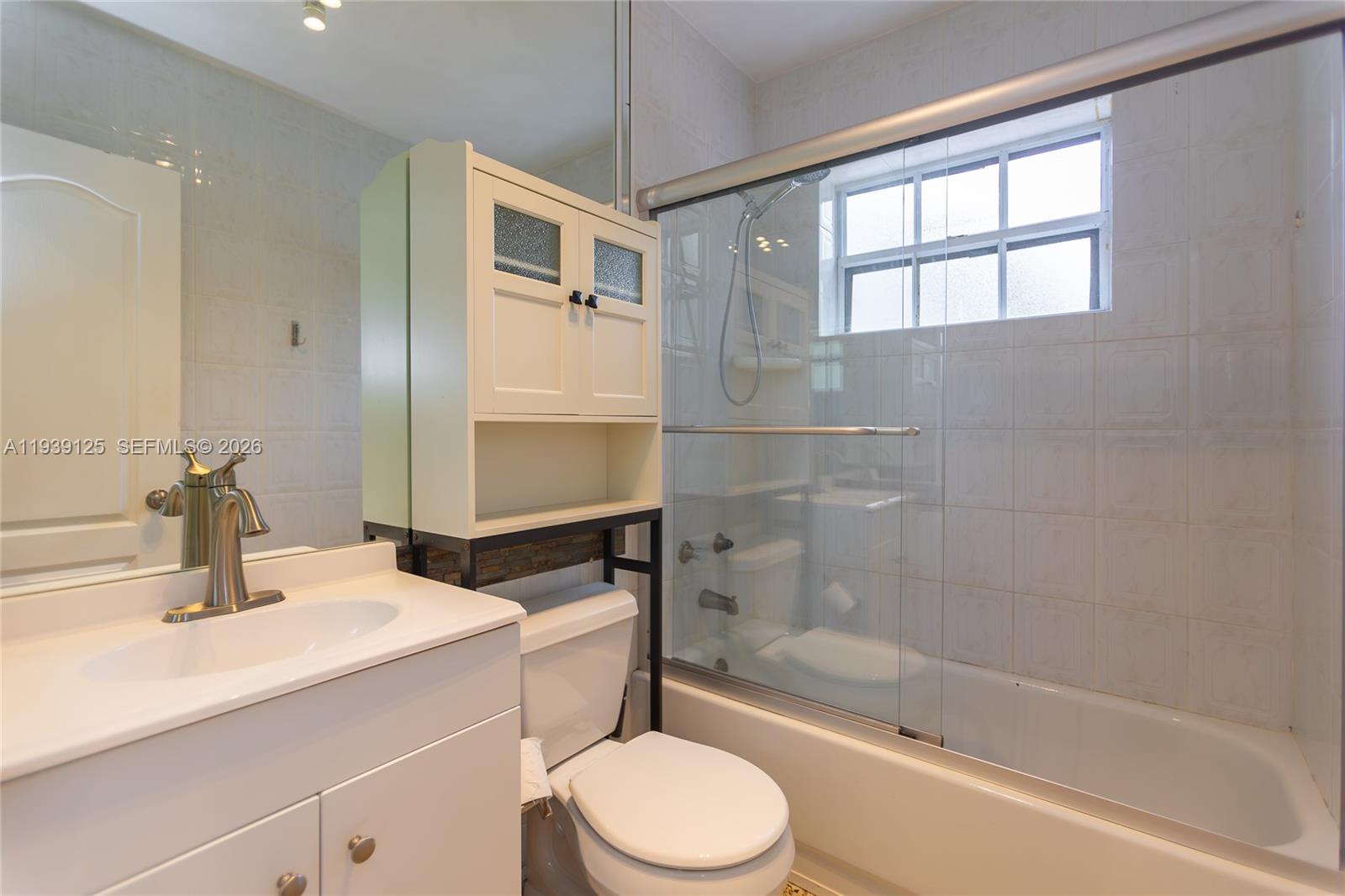 6765 Southwest 51st Street Miami, FL 33155 - Photo 42 of 43 a bathroom with a sink toilet and shower