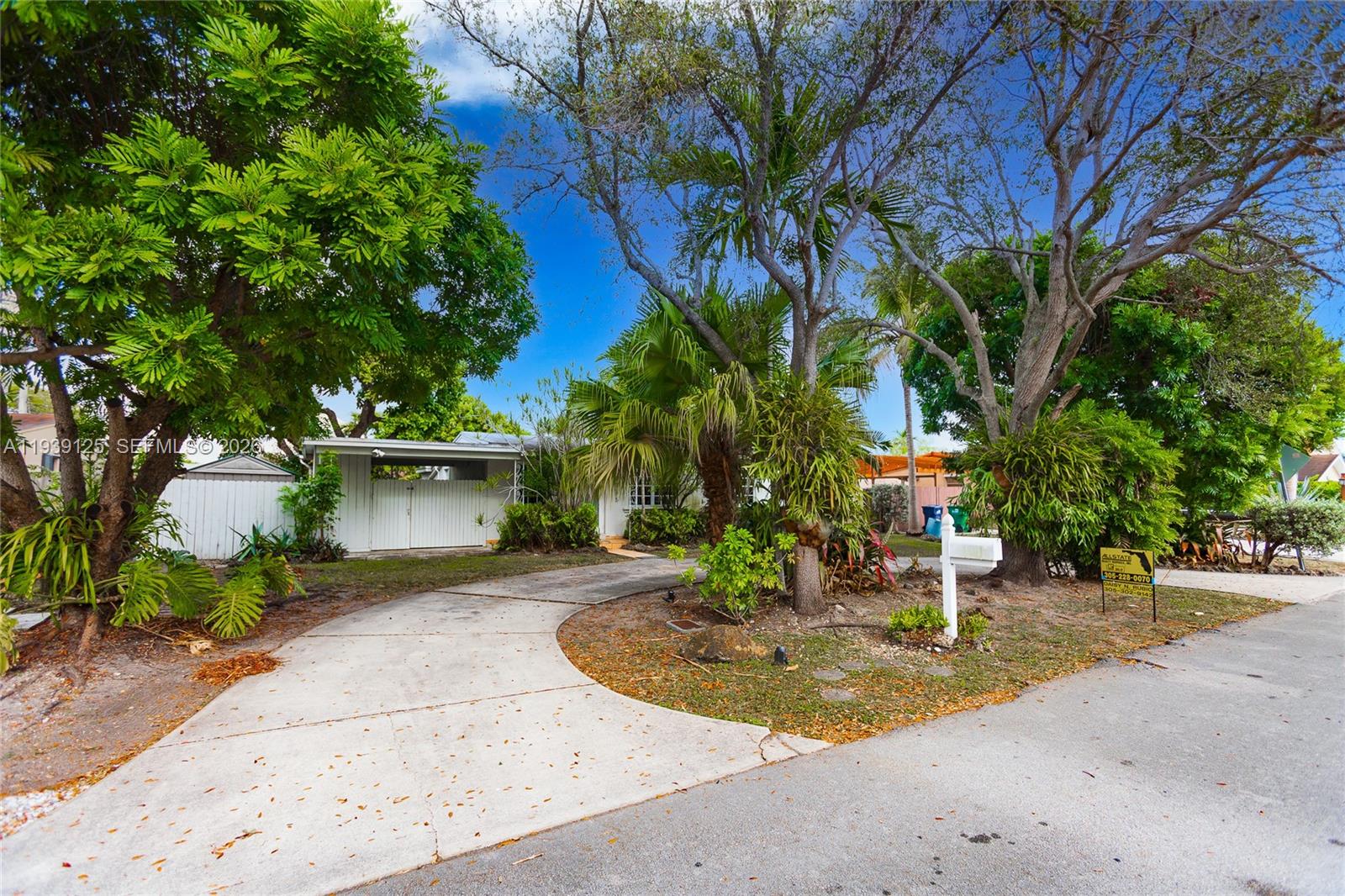 6765 Southwest 51st Street Miami, FL 33155 - Photo 10 of 43 a view of a house with a yard and tree s