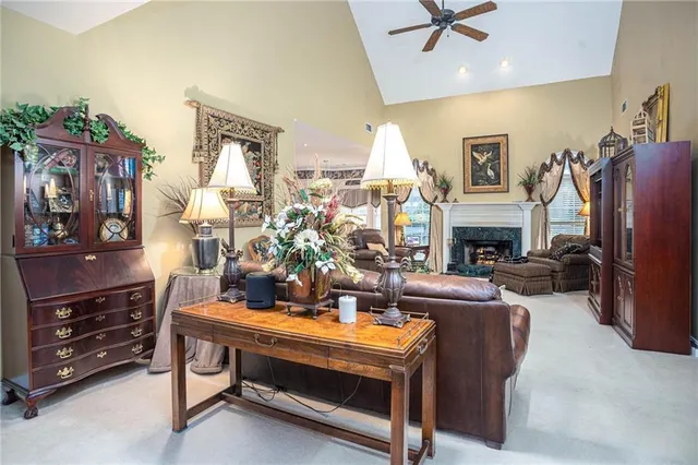 a bedroom with a bed and a large mirror next to a window