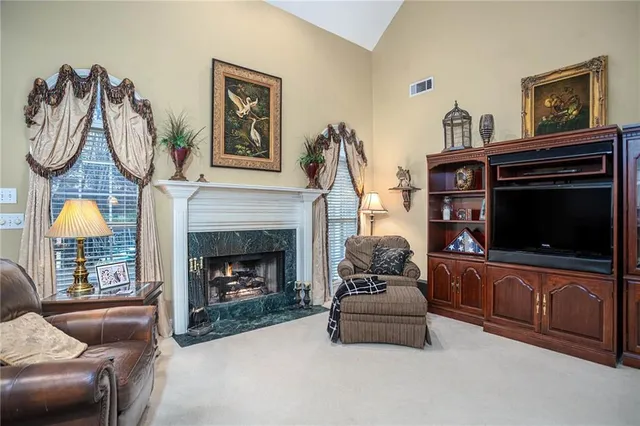a bathroom with a tub a sink and mirror