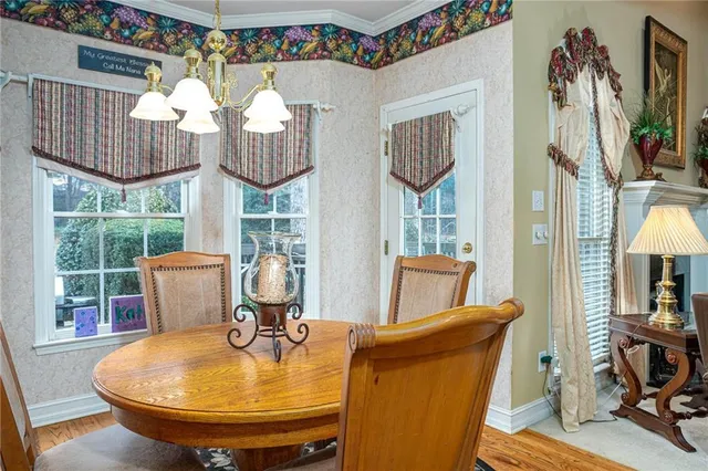 a bathroom with a sink a toilet a mirror and shower