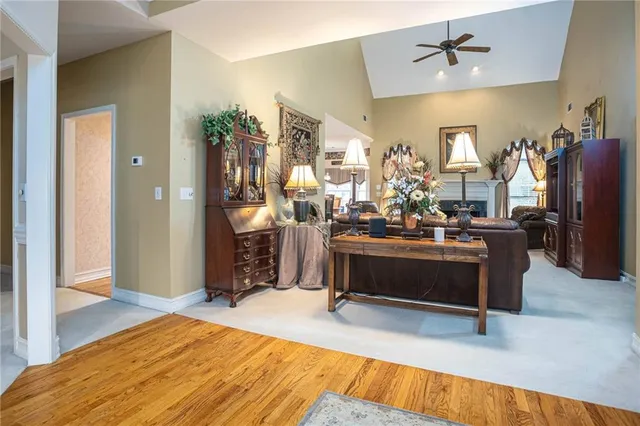 a dining room with furniture and chandelier