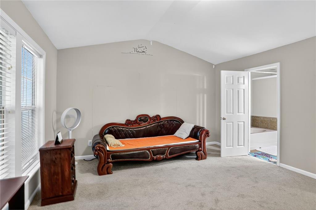 3053 Hartright Bend Court Duluth, GA 30096 - Photo 12 of 24 a blue room with furniture and a window