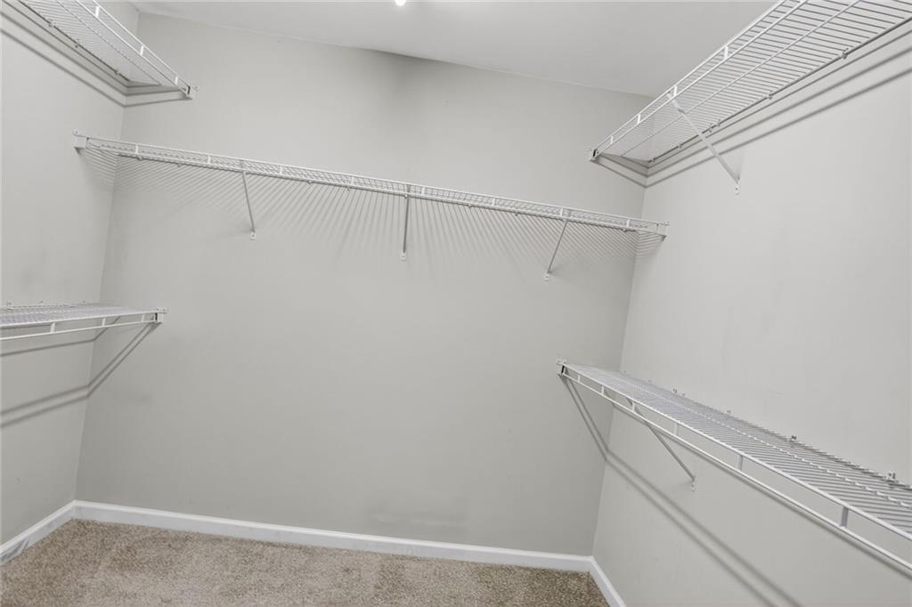 3053 Hartright Bend Court Duluth, GA 30096 - Photo 17 of 24 a view of a room with racks on the wall