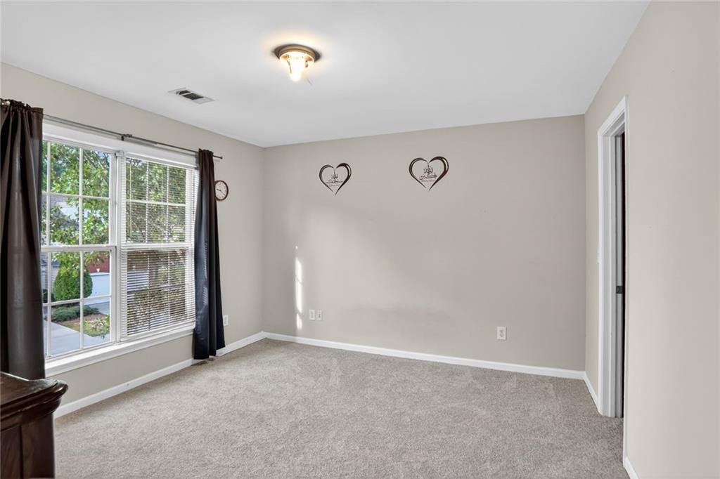3053 Hartright Bend Court Duluth, GA 30096 - Photo 19 of 24 a view of an empty room with a window