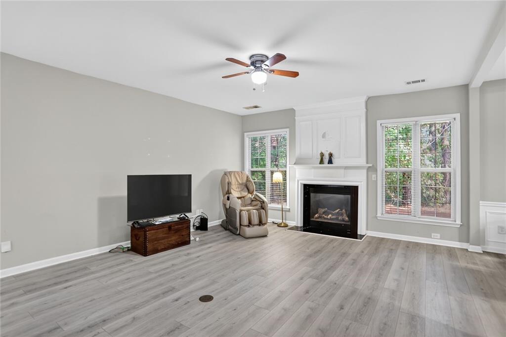 3053 Hartright Bend Court Duluth, GA 30096 - Photo 3 of 24 a living room with furniture fireplace and flat screen tv