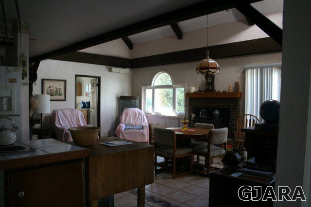 3839 G Road Palisade, CO 81526 - Photo 3 of 13 a living room with furniture and a fireplace