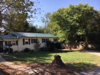 63236325 Ridgeview Road Knoxville, TN 37918 - Photo 1 of 13 a front view of a house with garden